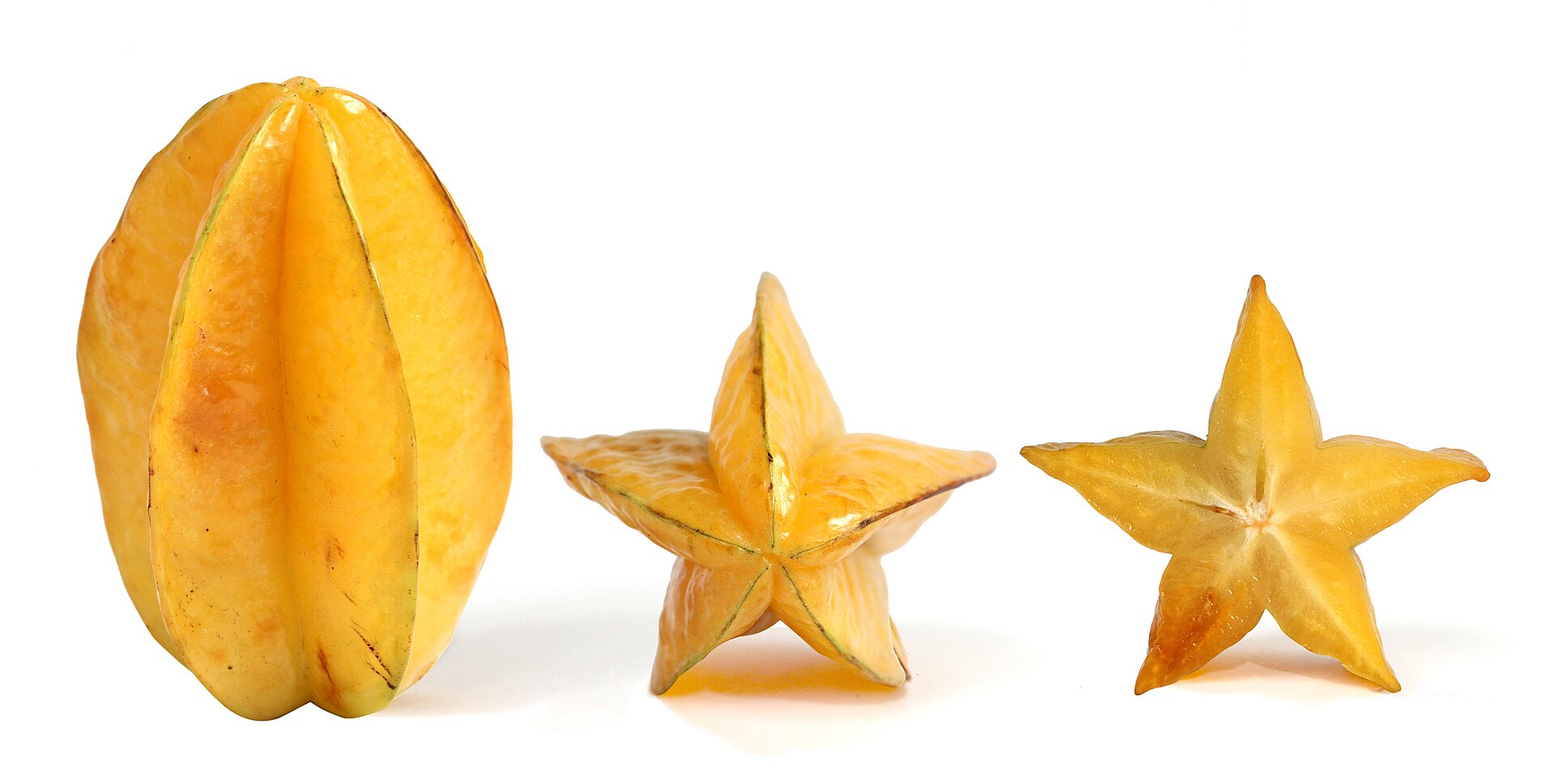 Ripe Carambolas, also known as starfruit, the fruit of Averrhoa carambola tree: vertical, side and cross section profiles. The fruit in cross section is a five-pointed star, hence its name.