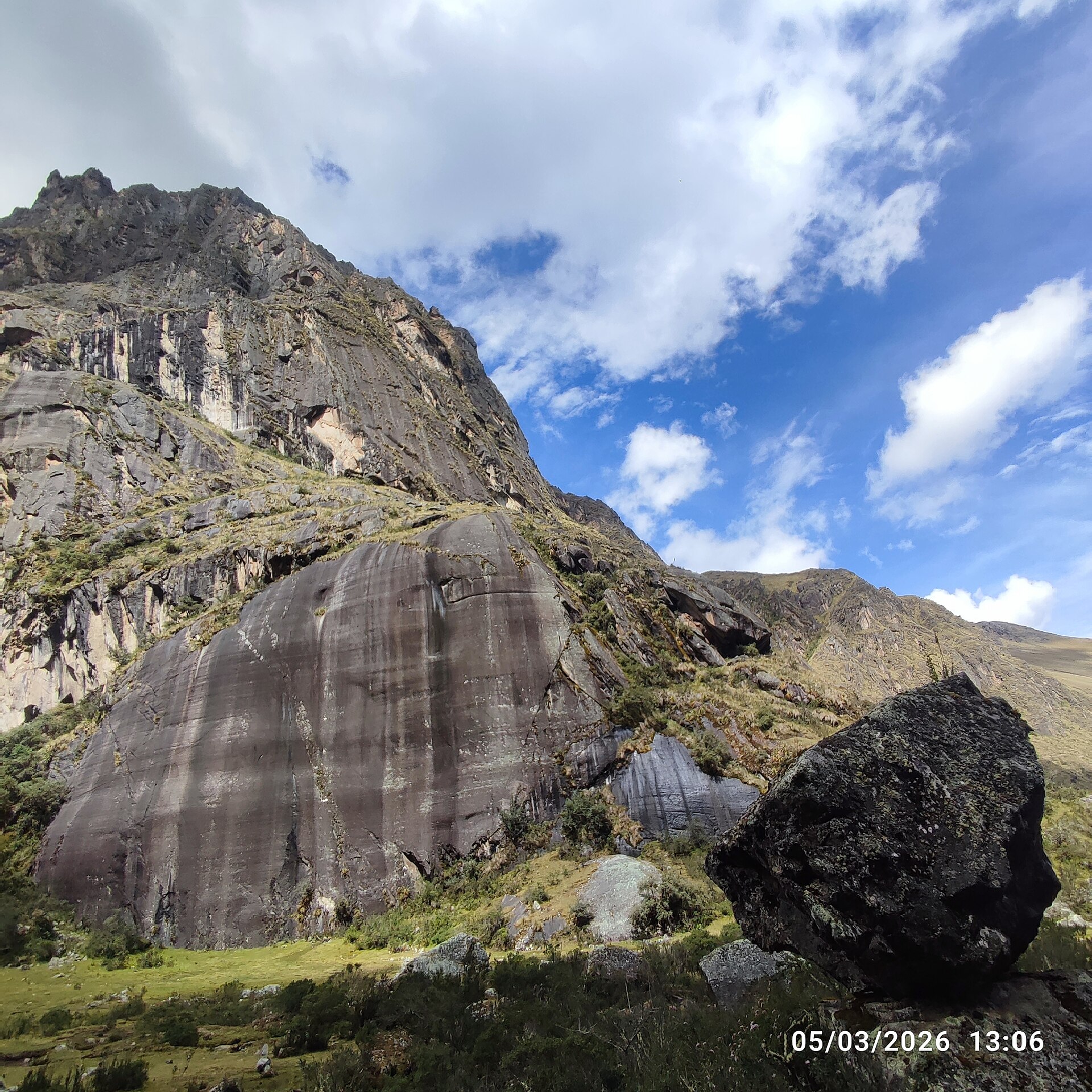 The picture depicts this natural landscape in the private conservation area called Suttoc Pacha, located in Urubamba province of the Cusco region, that belong to Peru. On the pathway to Chupani, an archaeological site, we can appreciate a glamorous forest where maintain ancient trees, unique species of flowers, alongside a clear river with rocks of various sizes scattered along its bed and riverbanks. This dense forest, characterised by countless tall, slender trees, some of them are yellow coloured bark species, such as Arrayan (Luma apiculata) and other Andean native trees for instance, Queuña (Polylepis), Aliso (Alnus acuminata), Chachacomo (Escallonia resinosa), etc. On this dirt and rock path winding through a dense forest, it is usually used by backpackers who frequently practice hiking and trekking, who head up to Lares. Due to the dense foliage that creates areas where the light and shadow interplay, enhancing the sense of depth and mystery within the forest.